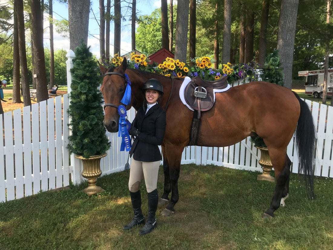 Absorbine Brand Manager Eileen Shaw standing with her horse Granby and their 