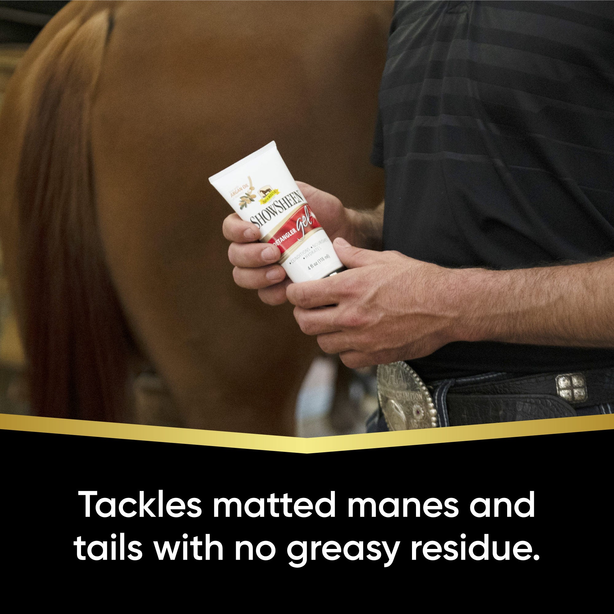 Man holding a tube of Showsheen detangler gel approaching a brown horse's tail.  Tackles matted manes and tails with no greasy residue.
