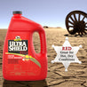 UltraShield® Red insecticide & repellent. Gallon of UltraShield® Red in the desert with the soil cracking under it, and a wagon wheel and sand dune in the distant background. UltraShield® Red great for hot, dry conditions.