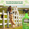 Girl sitting on the top of a white fence as her golden retriever puts his front paws on the rail next to her.  A white horse gazes over her shoulder at the golden retriever.  UltraShield Green Eco-safe fly spray for use around the entire family.